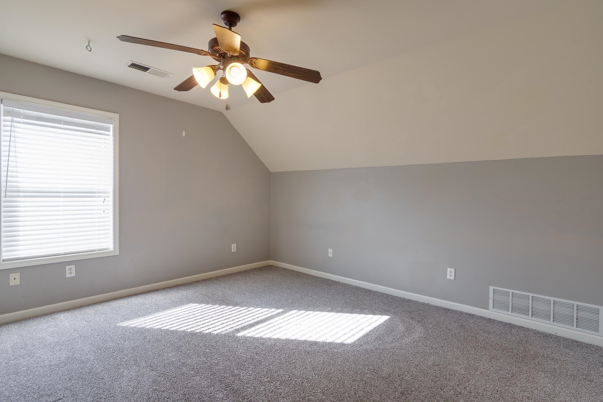 43 Tipton Rdg Cove Munford, TN 38058 - Photo 27 of 30 Additional lbedroom with a ceiling fan, vaulted ceiling, and carpet floors