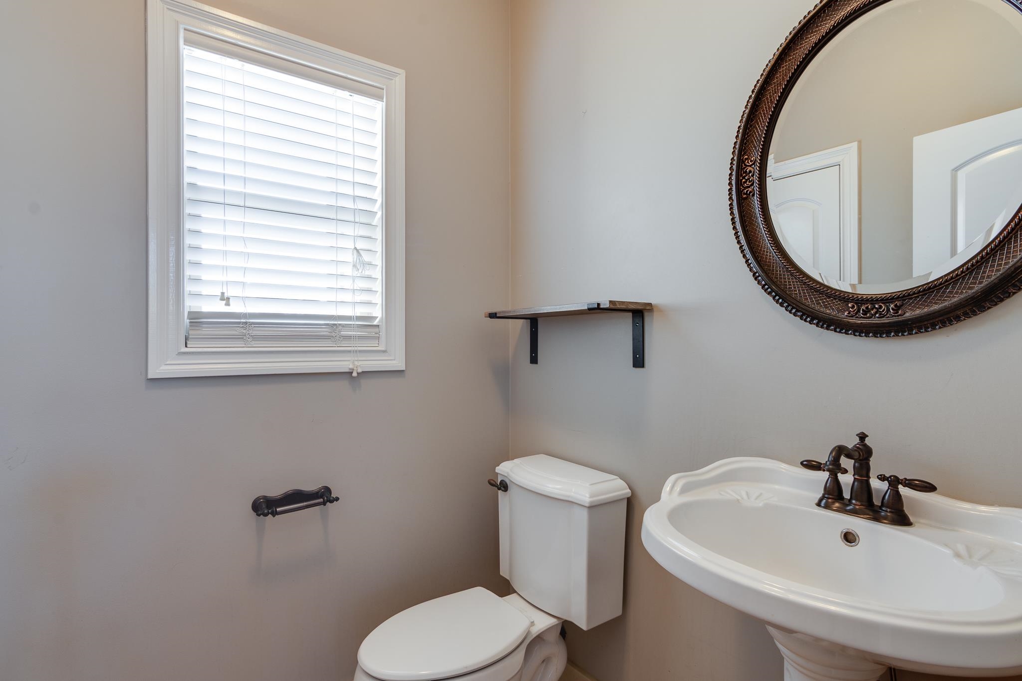 43 Tipton Rdg Cove Munford, TN 38058 - Photo 6 of 30 Half bath with toilet and a sink
