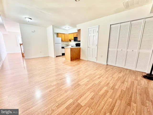 a view of a kitchen with wooden floor