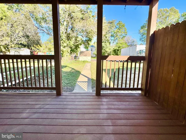a view of balcony with wooden floor
