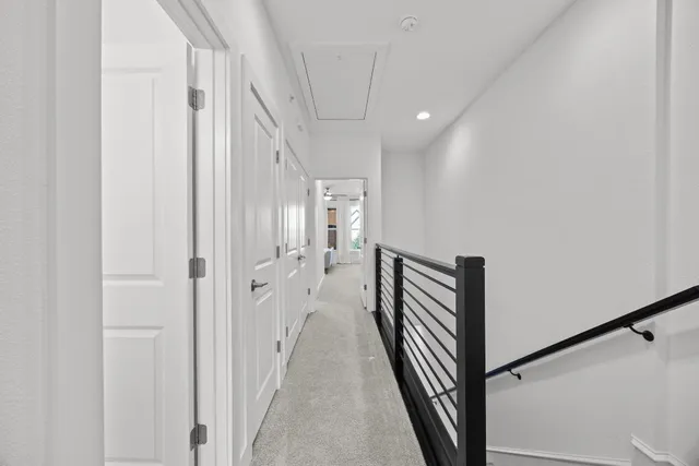 a view of a hallway with a white walls