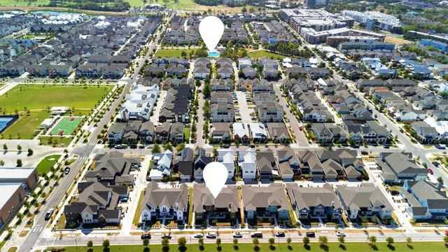 an aerial view of ocean with residential house with outdoor space