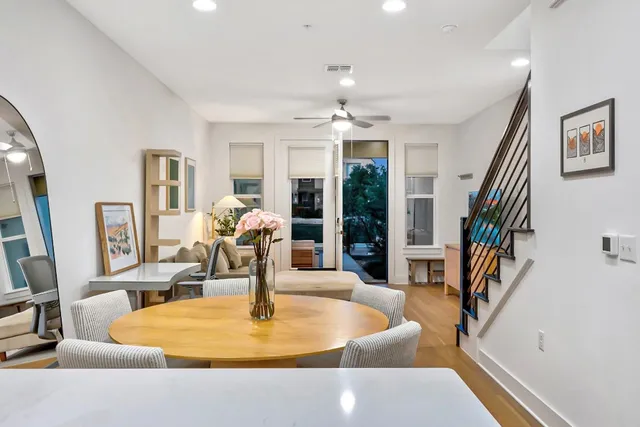a dining room with furniture a livingroom and chandelier