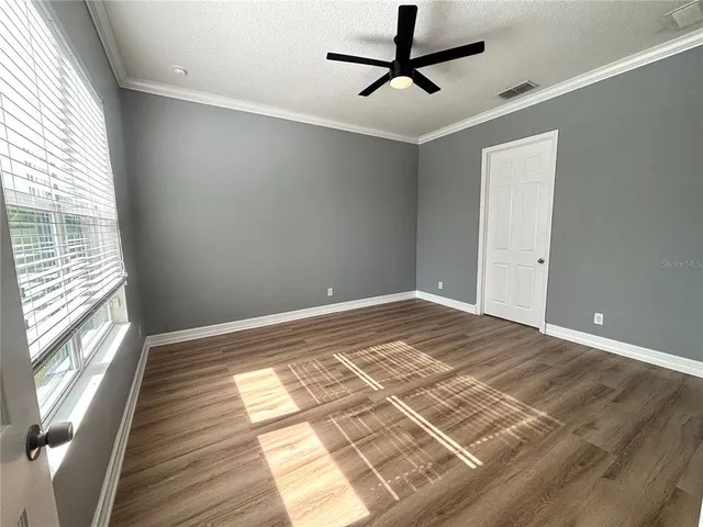 a spacious bathroom with a bathtub sink and mirror