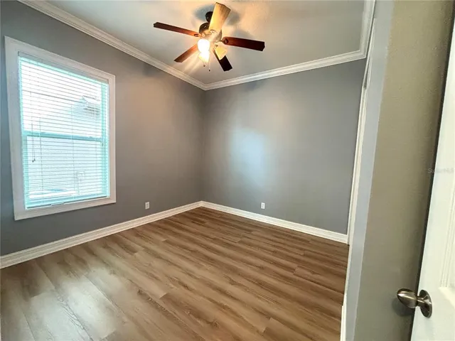 a view of room with a closet and wooden floor