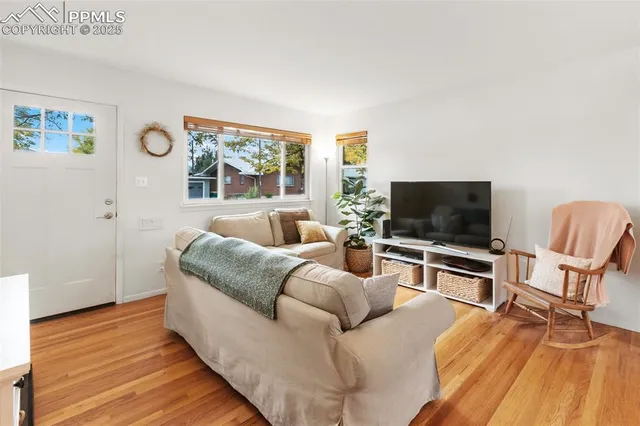 a living room with furniture and a flat screen tv