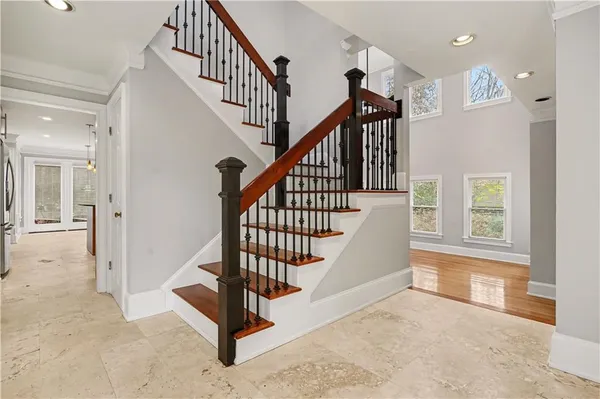 a view of entryway and hall with wooden floor