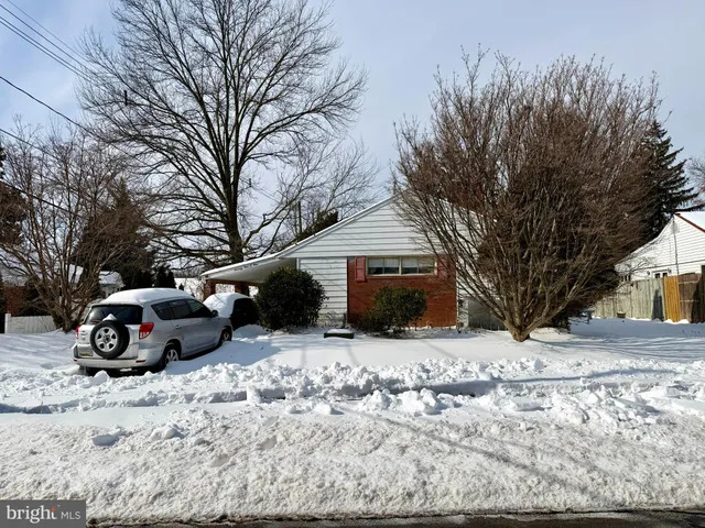 a view of a yard covered with snow