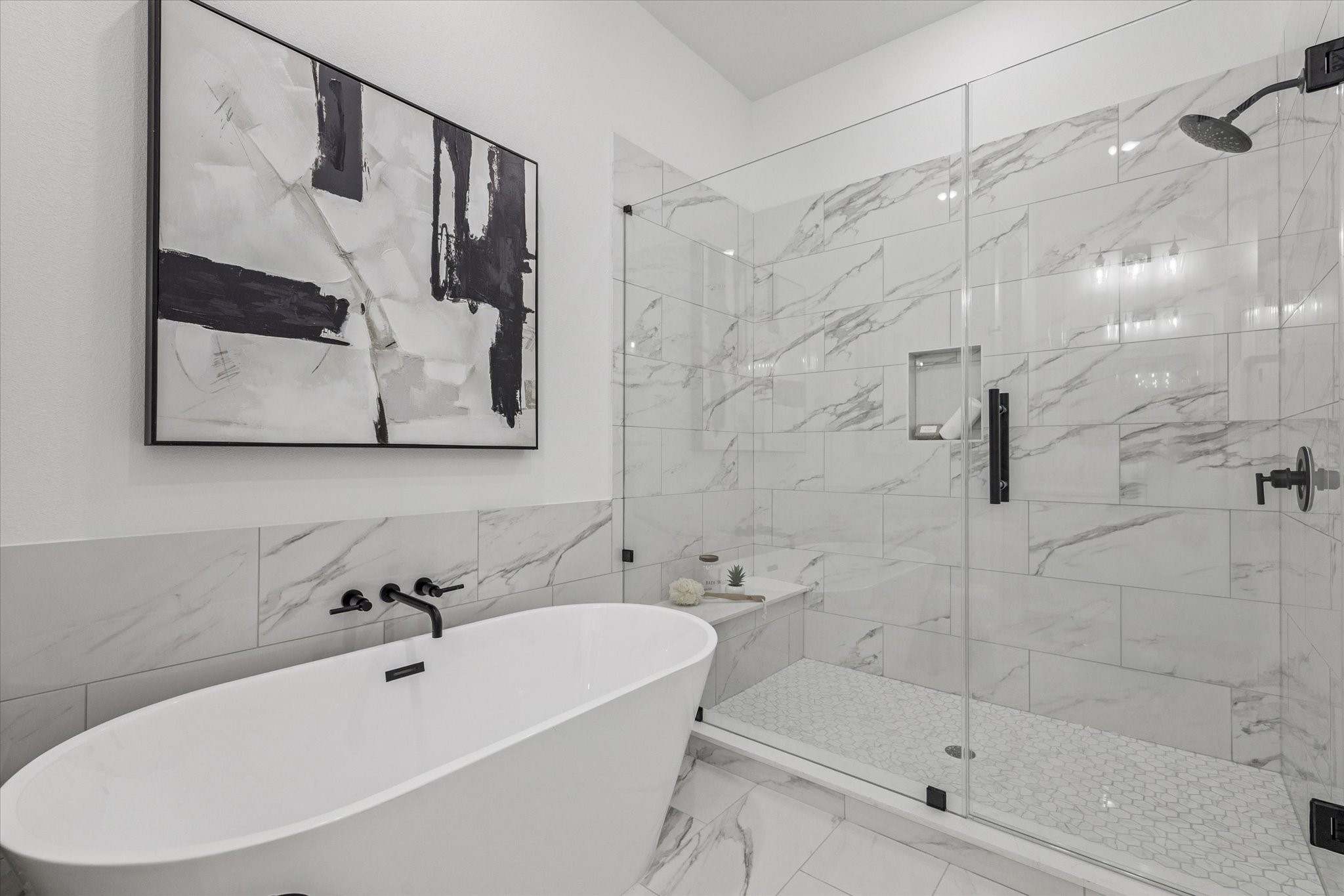 5612 Azores Houston, TX 77091 - Photo 26 of 38 a bathroom with a white bath tub a mirror and a shower