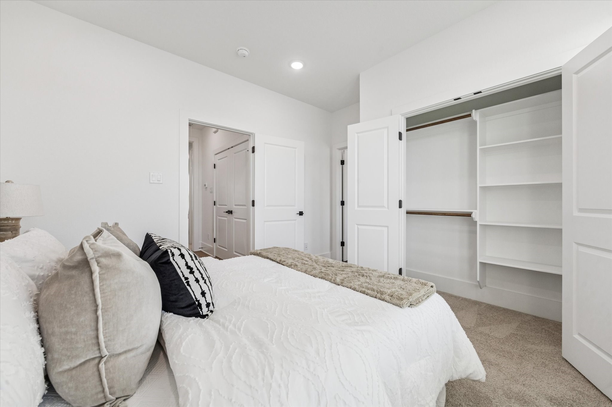 5612 Azores Houston, TX 77091 - Photo 29 of 38 a bedroom with a bed and closet