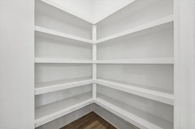 a storage room with wooden floor