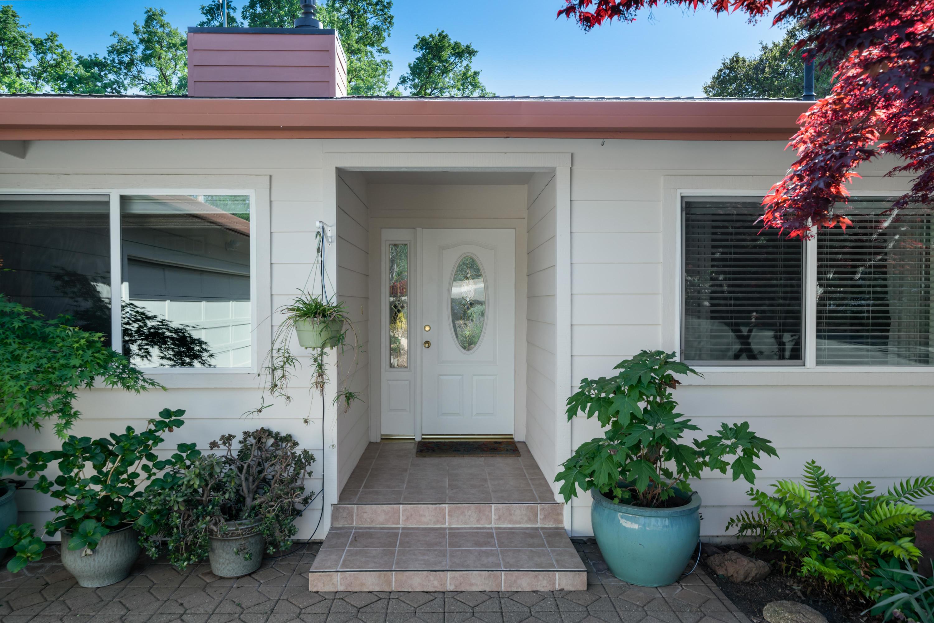 7777 Justice Mine Road Redding, CA 96001 - Photo 5 of 59 a view of a entryway door front of house