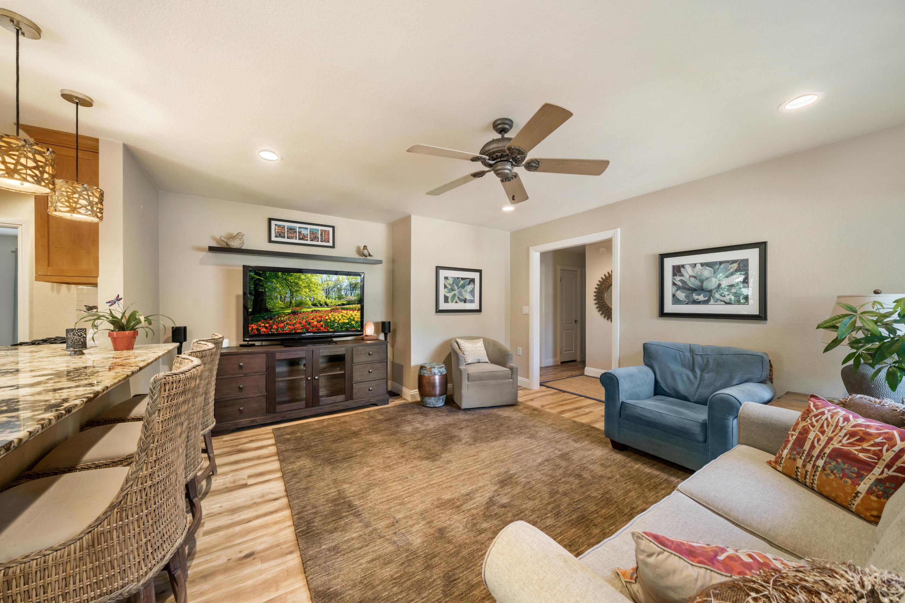 7777 Justice Mine Road Redding, CA 96001 - Photo 8 of 59 a living room with furniture and a flat screen tv