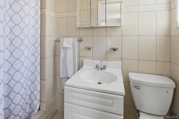 a bathroom with a toilet and a sink