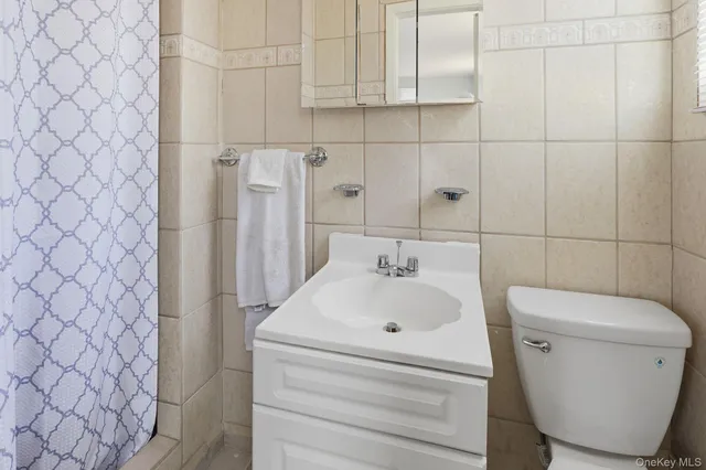 a bathroom with a toilet and a sink