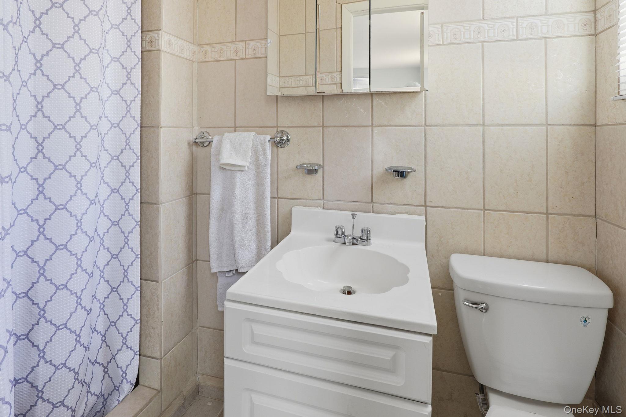 284 Bonnie Brook Road Roscoe, NY 12776 - Photo 14 of 25 a bathroom with a toilet and a sink