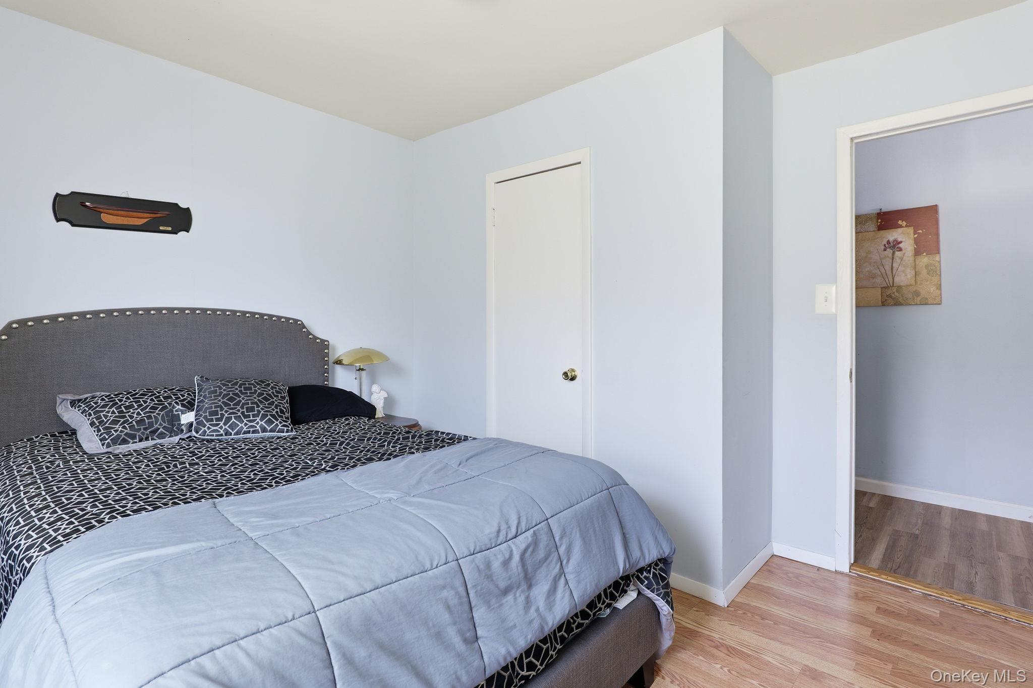 284 Bonnie Brook Road Roscoe, NY 12776 - Photo 17 of 25 a bedroom with a bed and wooden floor