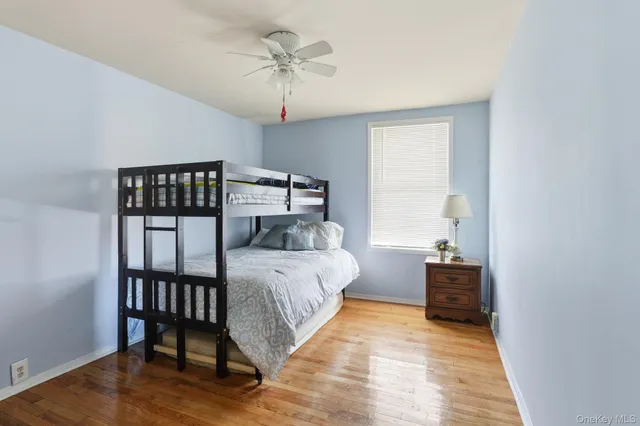 a bed room with a bed and a window