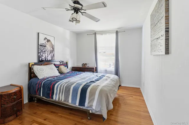 a bedroom with bed and a window