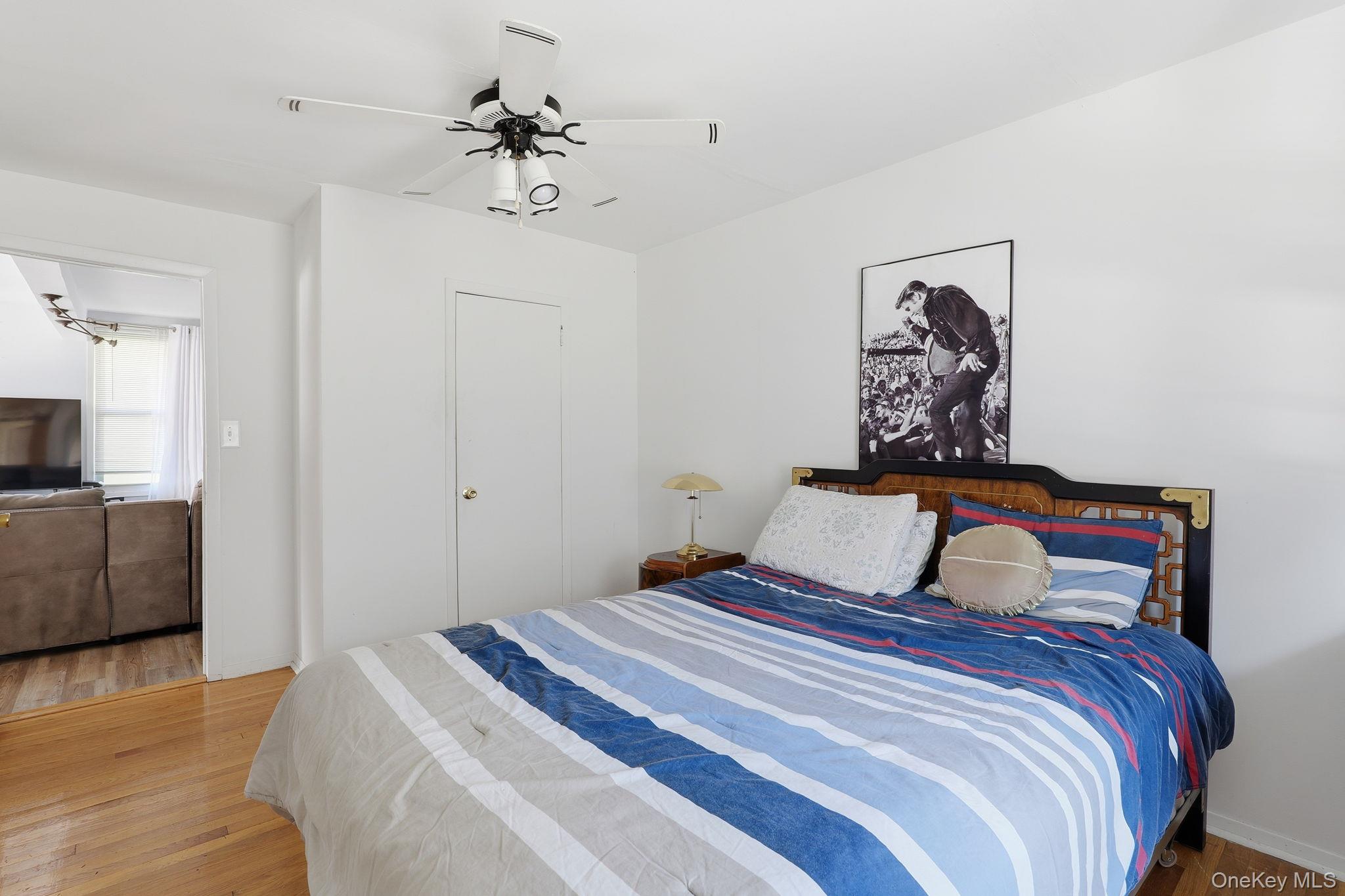 284 Bonnie Brook Road Roscoe, NY 12776 - Photo 22 of 25 a bedroom with a large bed and a chandelier