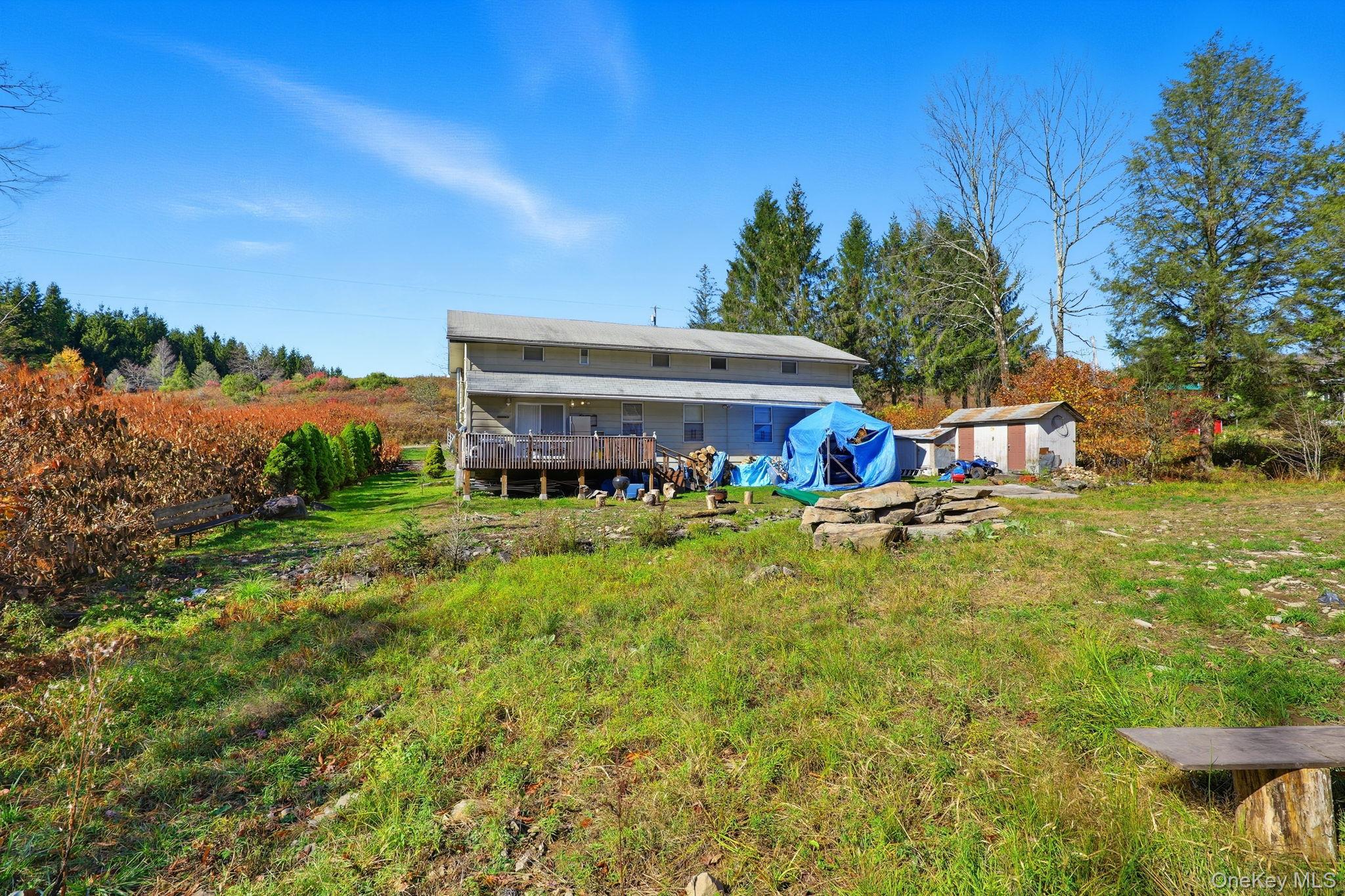 284 Bonnie Brook Road Roscoe, NY 12776 - Photo 24 of 25 a view of house with outdoor space and seating area