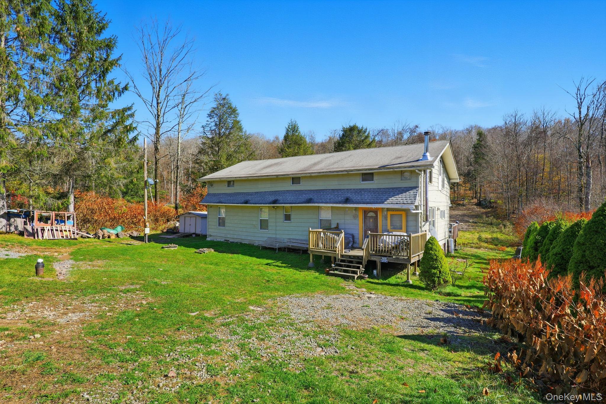 284 Bonnie Brook Road Roscoe, NY 12776 - Photo 3 of 25 a front view of a house with garden