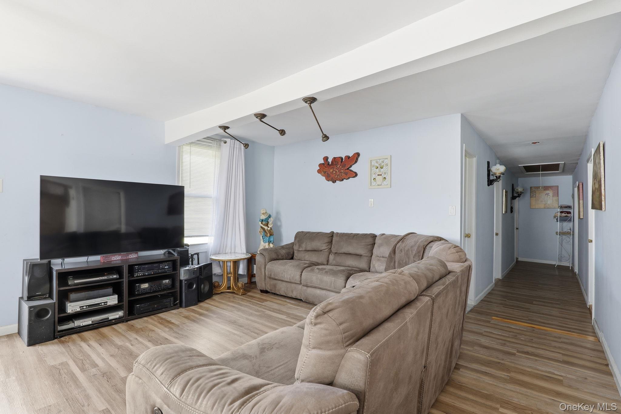 284 Bonnie Brook Road Roscoe, NY 12776 - Photo 5 of 25 a living room with furniture and a flat screen tv
