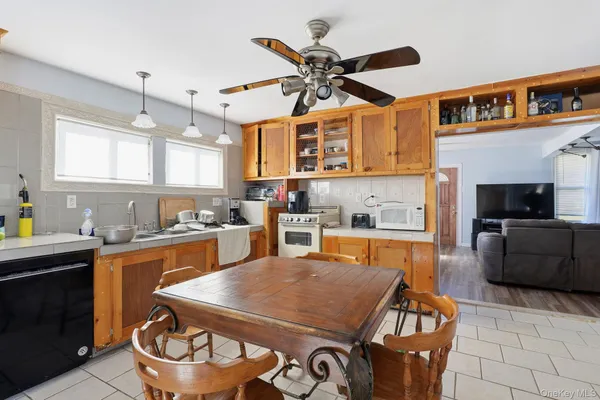 a kitchen with a stove a sink and a refrigerator