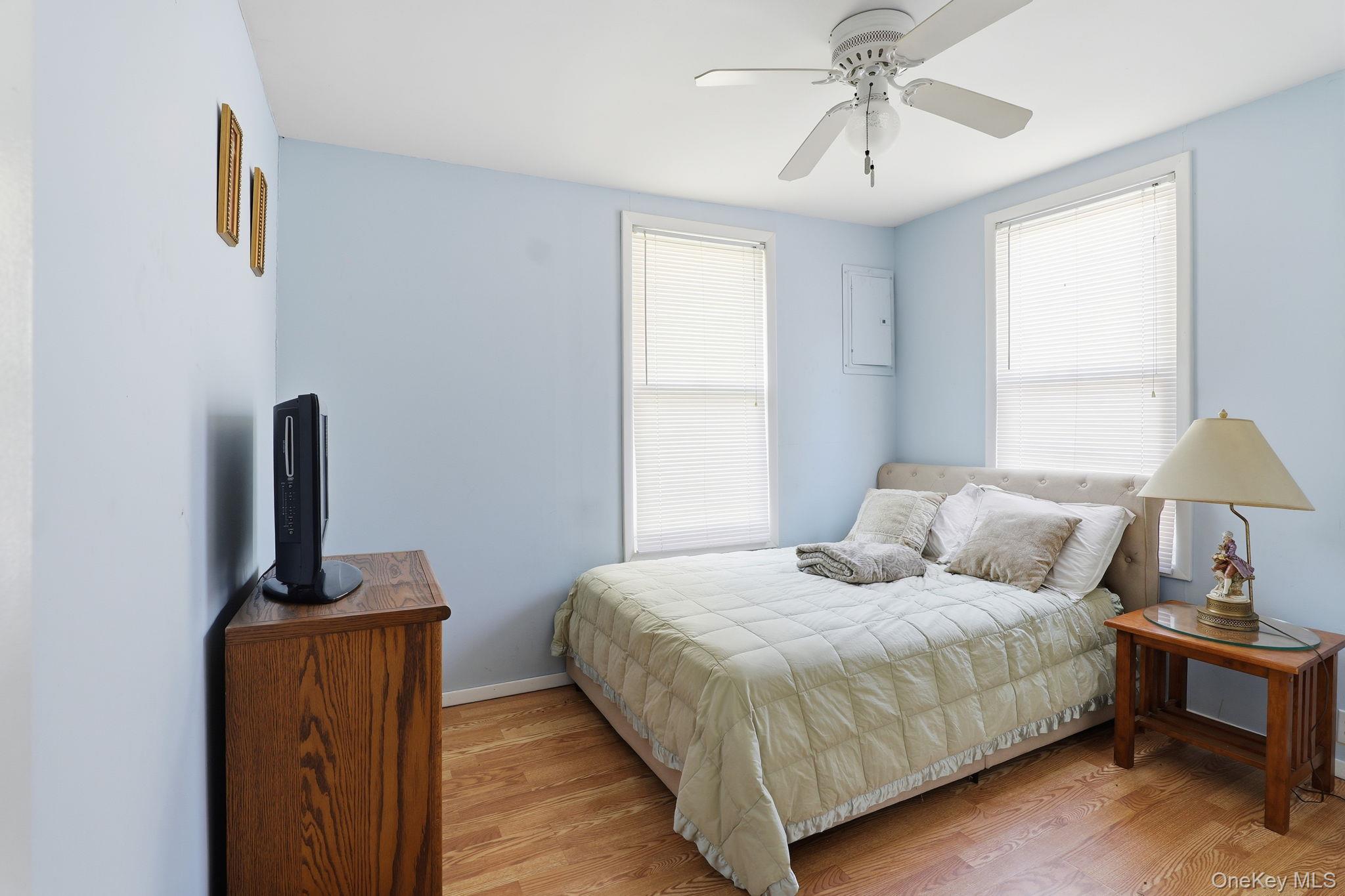 284 Bonnie Brook Road Roscoe, NY 12776 - Photo 9 of 25 a bedroom with a bed and wooden floor