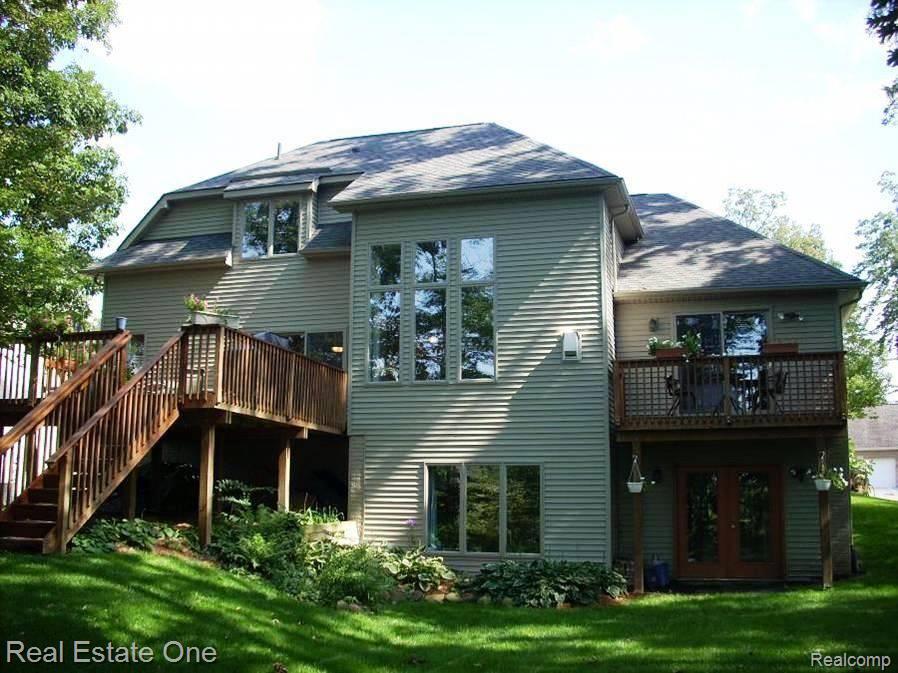1385 Remsing Street Hartland, MI 48353 - Photo 22 of 25 Rear View Of Home