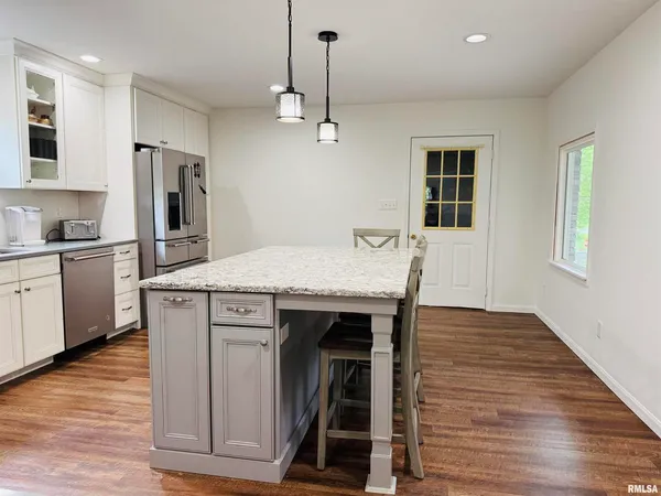 a kitchen that has a sink and a stove in it