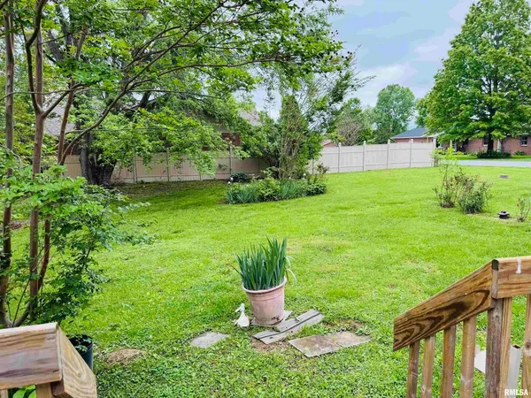 a view of a garden with a fountain