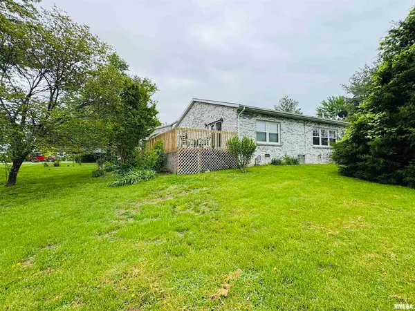 a front view of house with garden