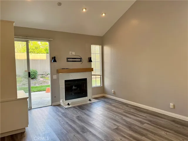 a view of a livingroom with an empty kitchen