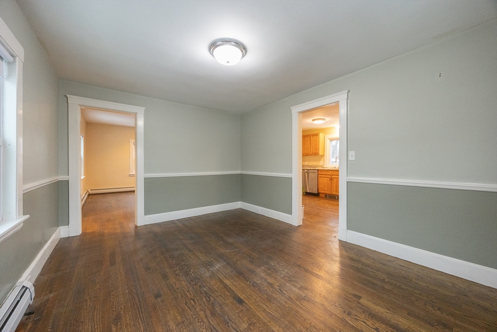 21 Manning Street Salem, MA 01970 - Photo 13 of 26 an empty room with wooden floor and windows