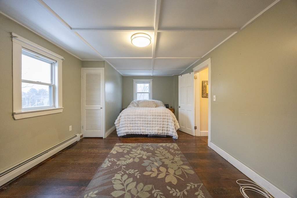 21 Manning Street Salem, MA 01970 - Photo 22 of 26 a view of a livingroom with wooden floor windows and chandelier