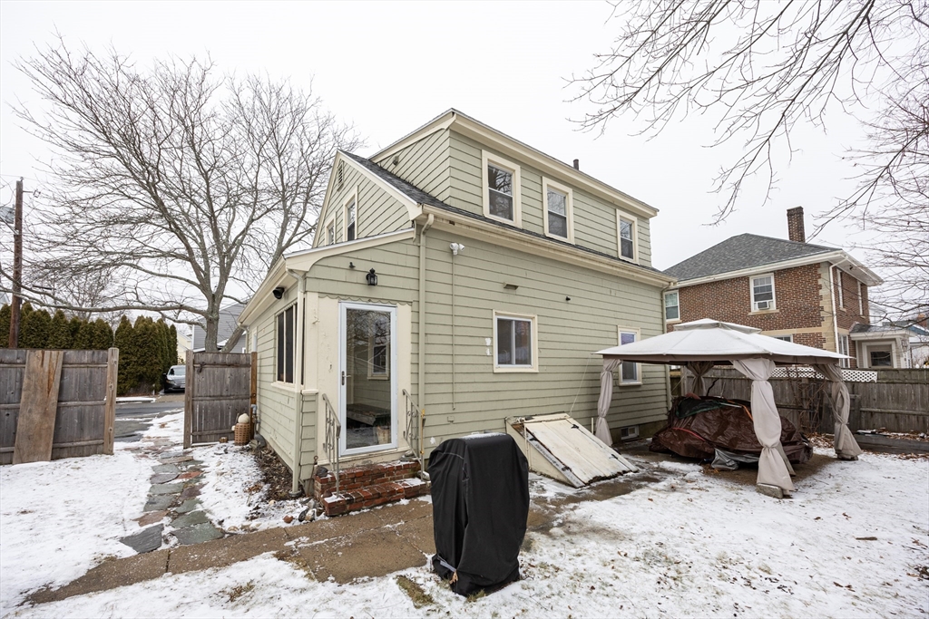 21 Manning Street Salem, MA 01970 - Photo 5 of 26 a front view of a house with yard outdoor seating and barbeque oven