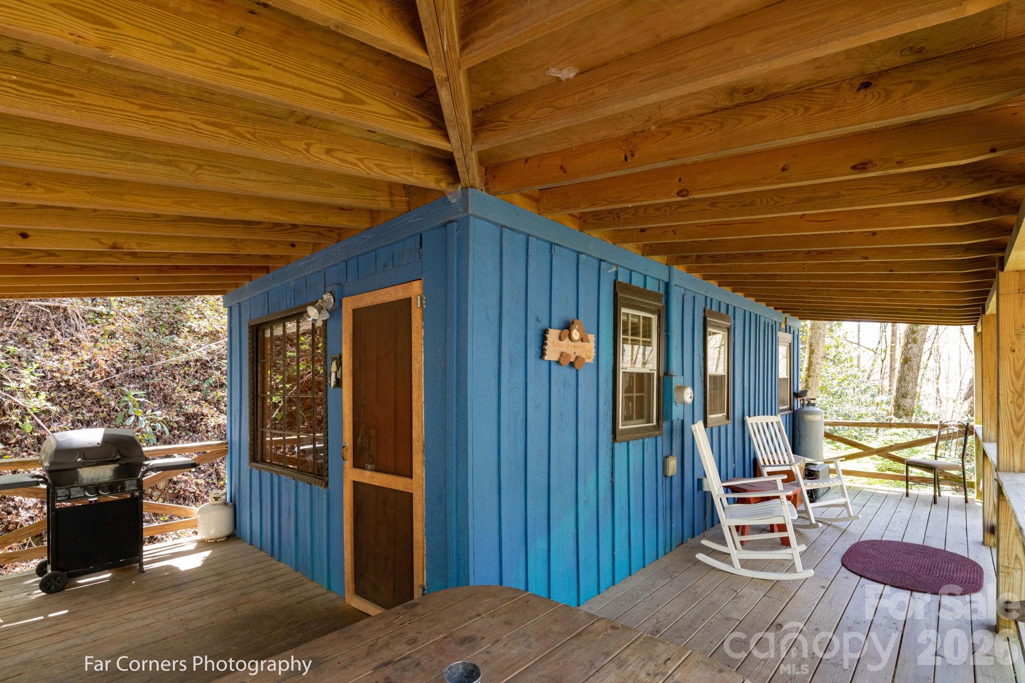 2670 Dicks Creek Road Whittier, NC 28789 - Photo 14 of 21 a bed room with a bed and a table