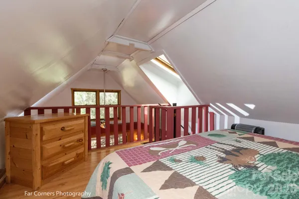 a bed room with a bed and a chandelier