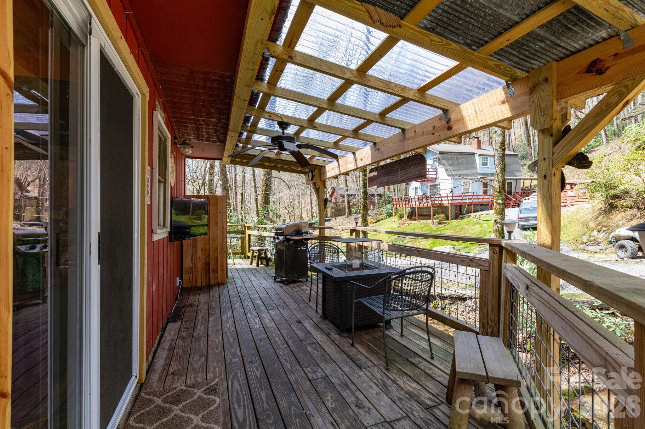 2670 Dicks Creek Road Whittier, NC 28789 - Photo 2 of 21 a view of a chairs and table in a balcony
