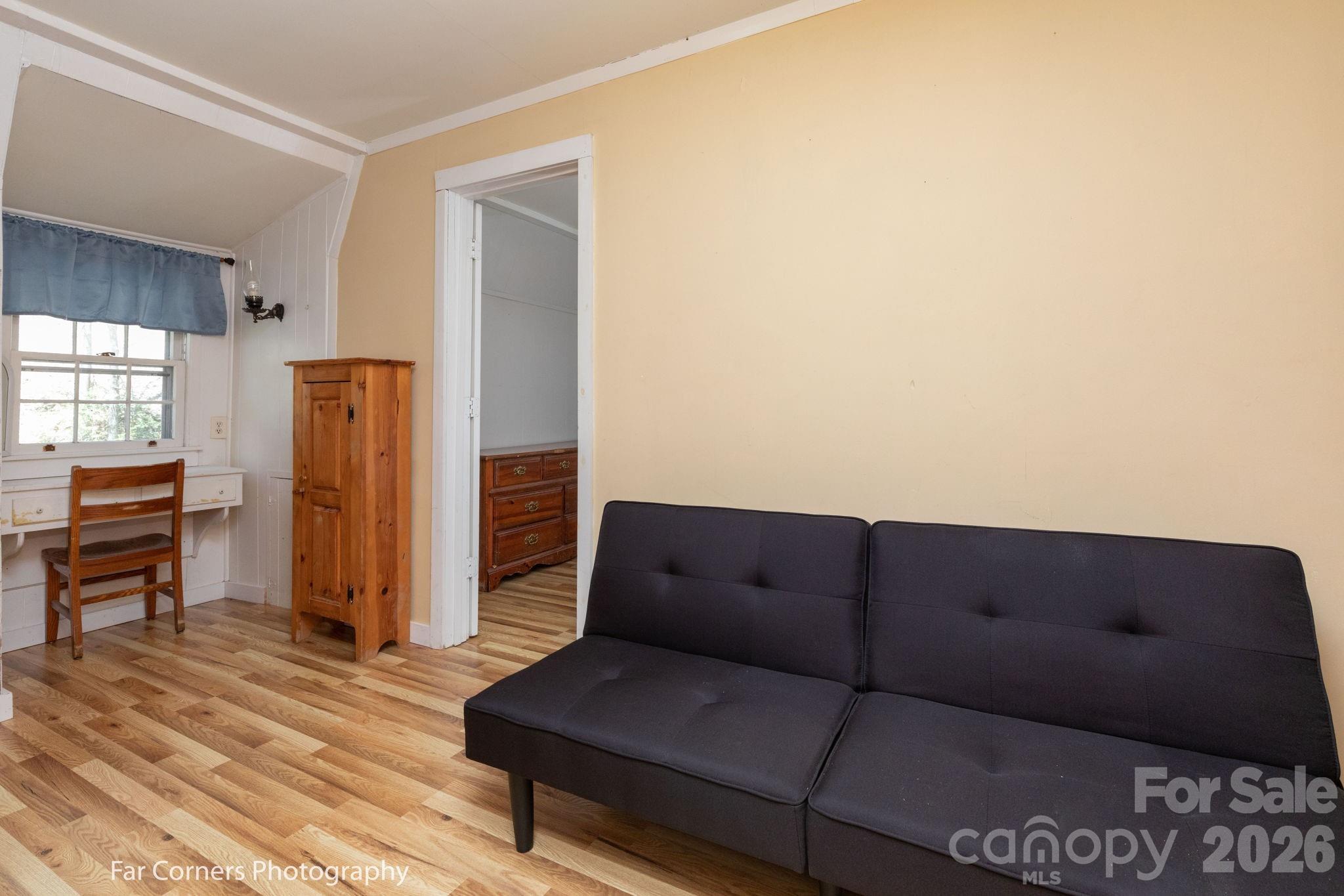 2670 Dicks Creek Road Whittier, NC 28789 - Photo 7 of 21 a living room with furniture and a wooden floor
