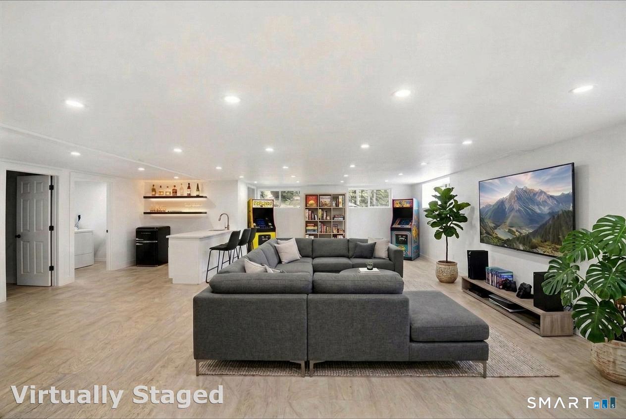 12 Darien Road New Fairfield, CT 06812 - Photo 18 of 31 Basement w/ wet bar/recreation room, laundry room, storage room, and full bathroom.