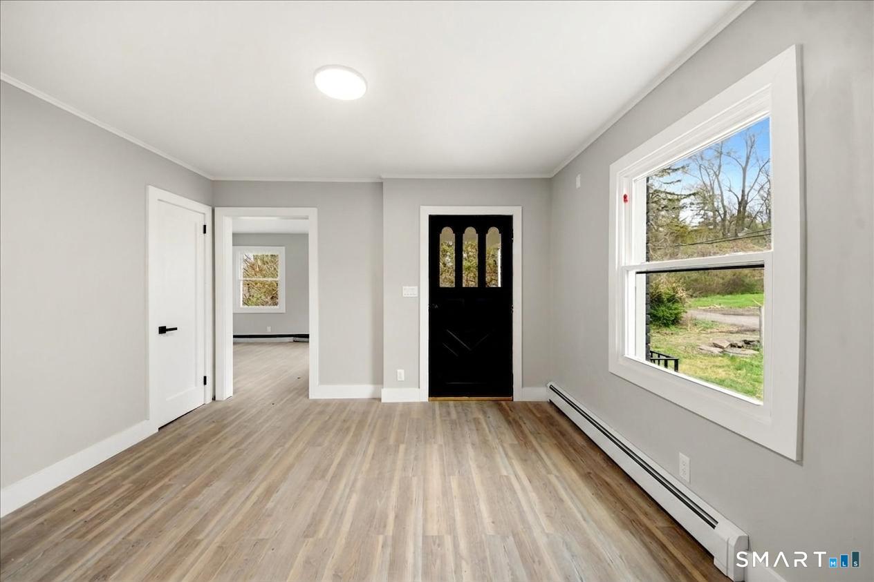 12 Darien Road New Fairfield, CT 06812 - Photo 3 of 31 Entry on main floor into dining area.