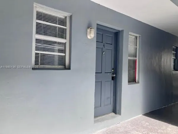 a view of a hallway with windows
