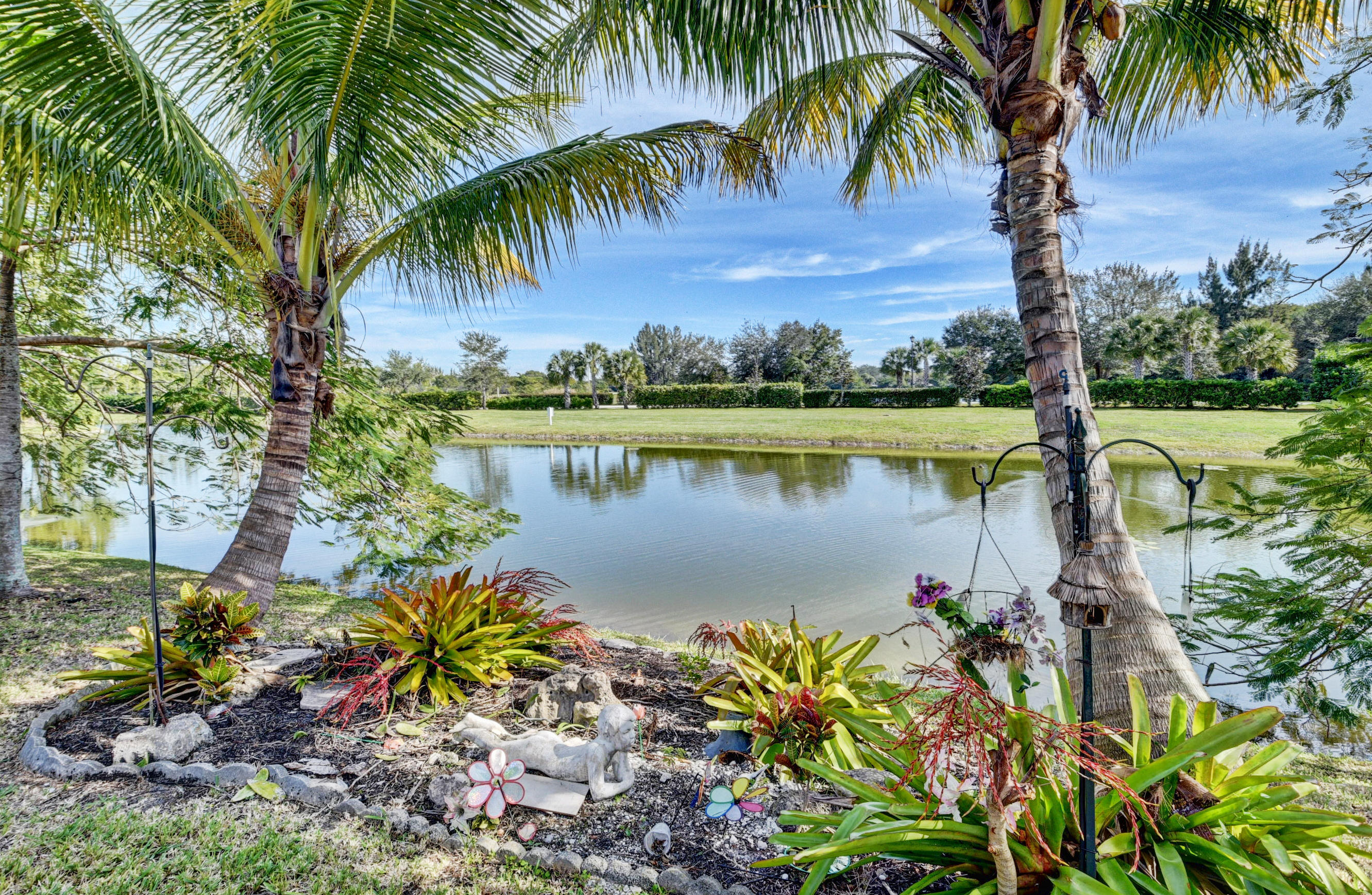 12059 Rockwell Way Boca Raton, FL 33428 - Photo 26 of 28 a body of water with a tree in the background