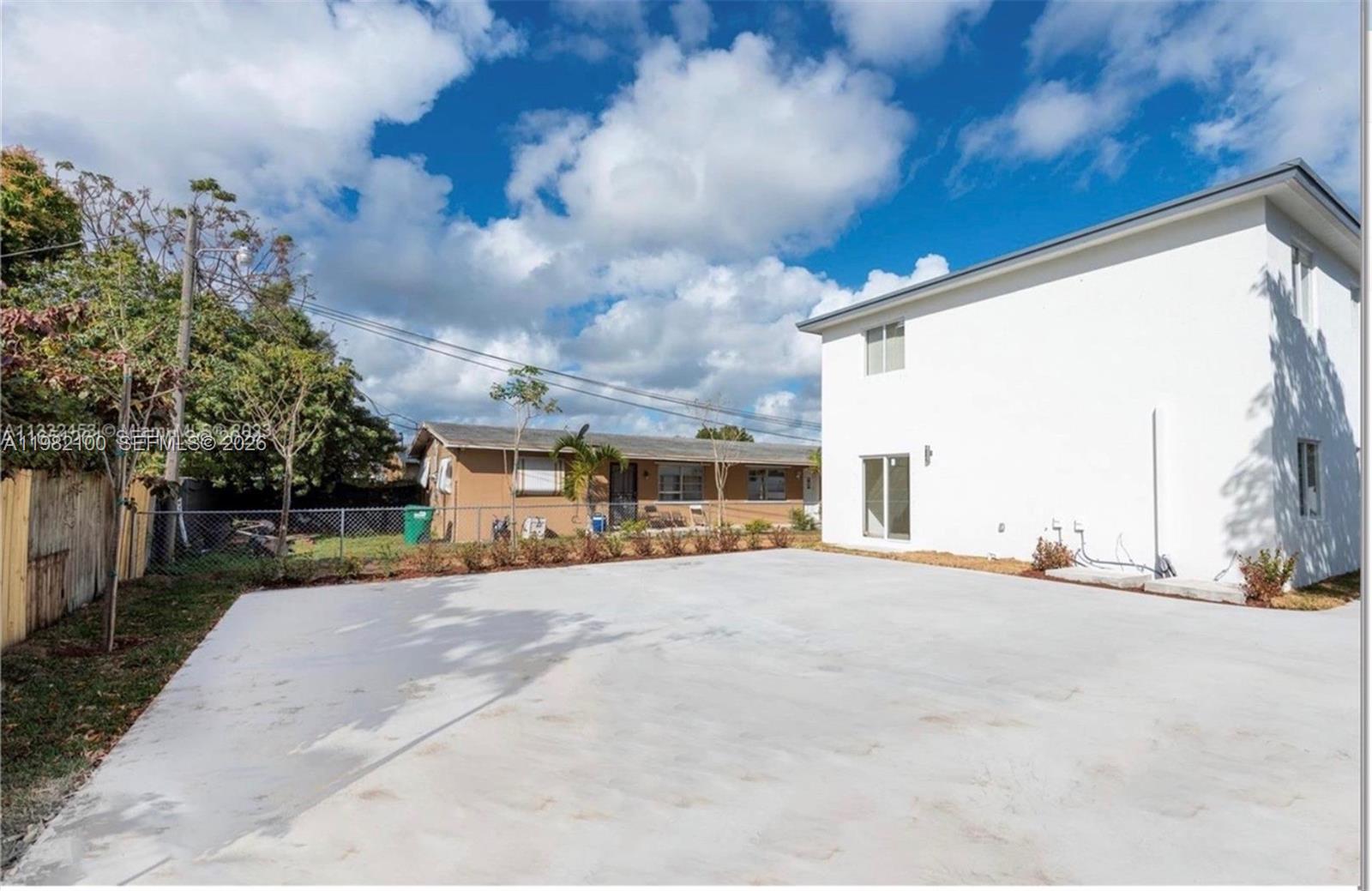 10384 Southwest 173rd Street, Unit 2 Miami, FL 33157 - Photo 11 of 12 a view of a house with a patio