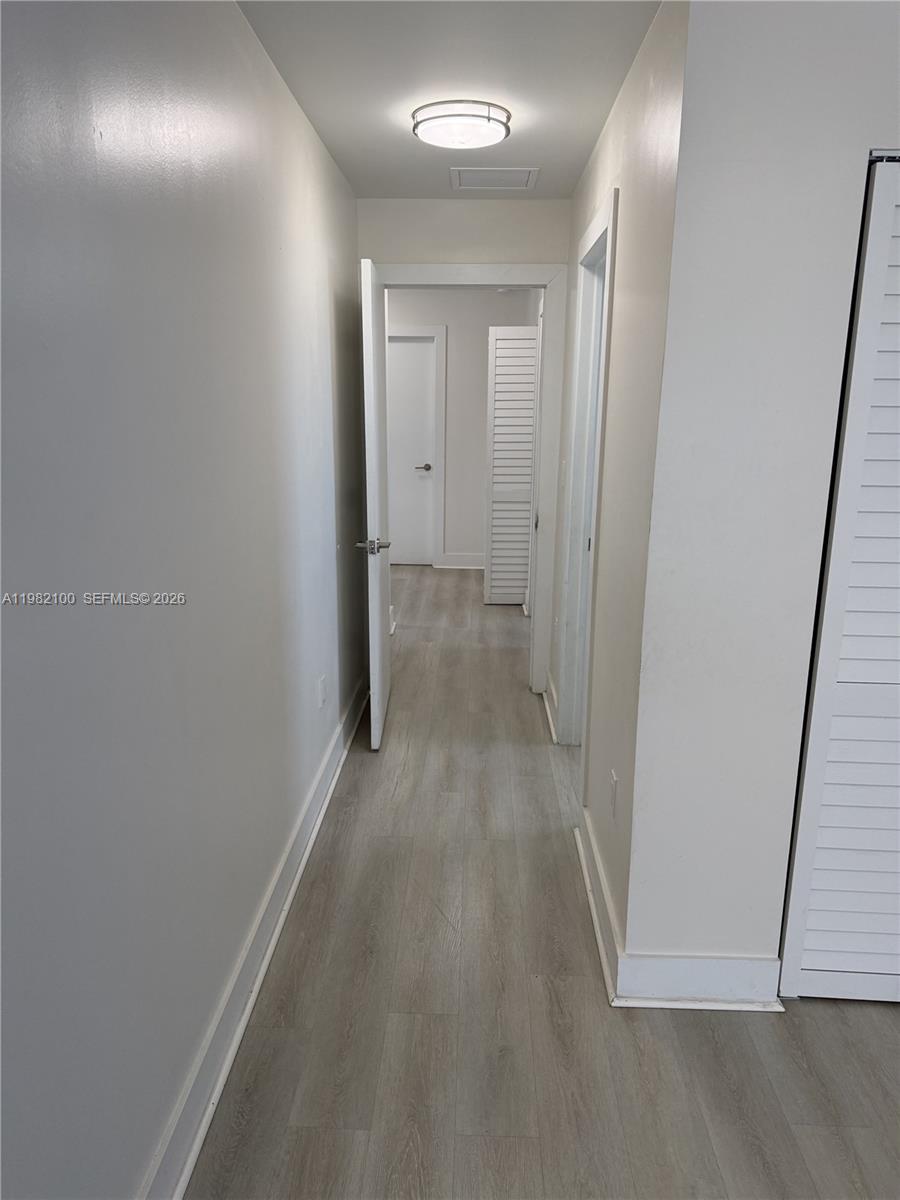 10384 Southwest 173rd Street, Unit 2 Miami, FL 33157 - Photo 4 of 12 a view of a hallway
