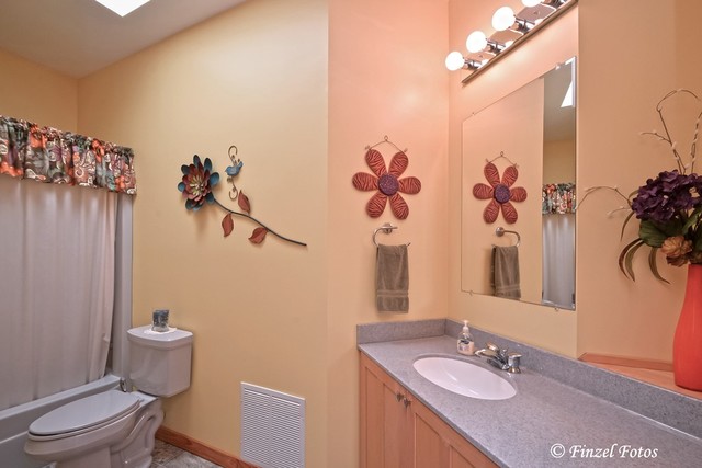 30813 Lincoln Road Genoa, IL 60135 - Photo 15 of 20 a bathroom with a granite countertop sink toilet and shower
