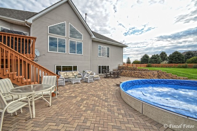 30813 Lincoln Road Genoa, IL 60135 - Photo 17 of 20 a view of a house with swimming pool and sitting area
