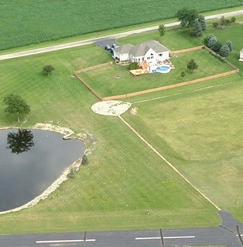 30813 Lincoln Road Genoa, IL 60135 - Photo 3 of 20 a white bath tub sitting in middle of a yard